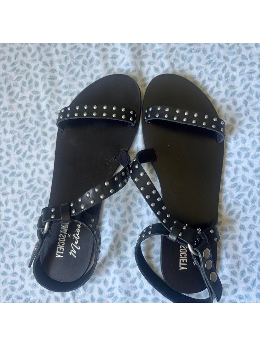 Black leather sandals with silver studs